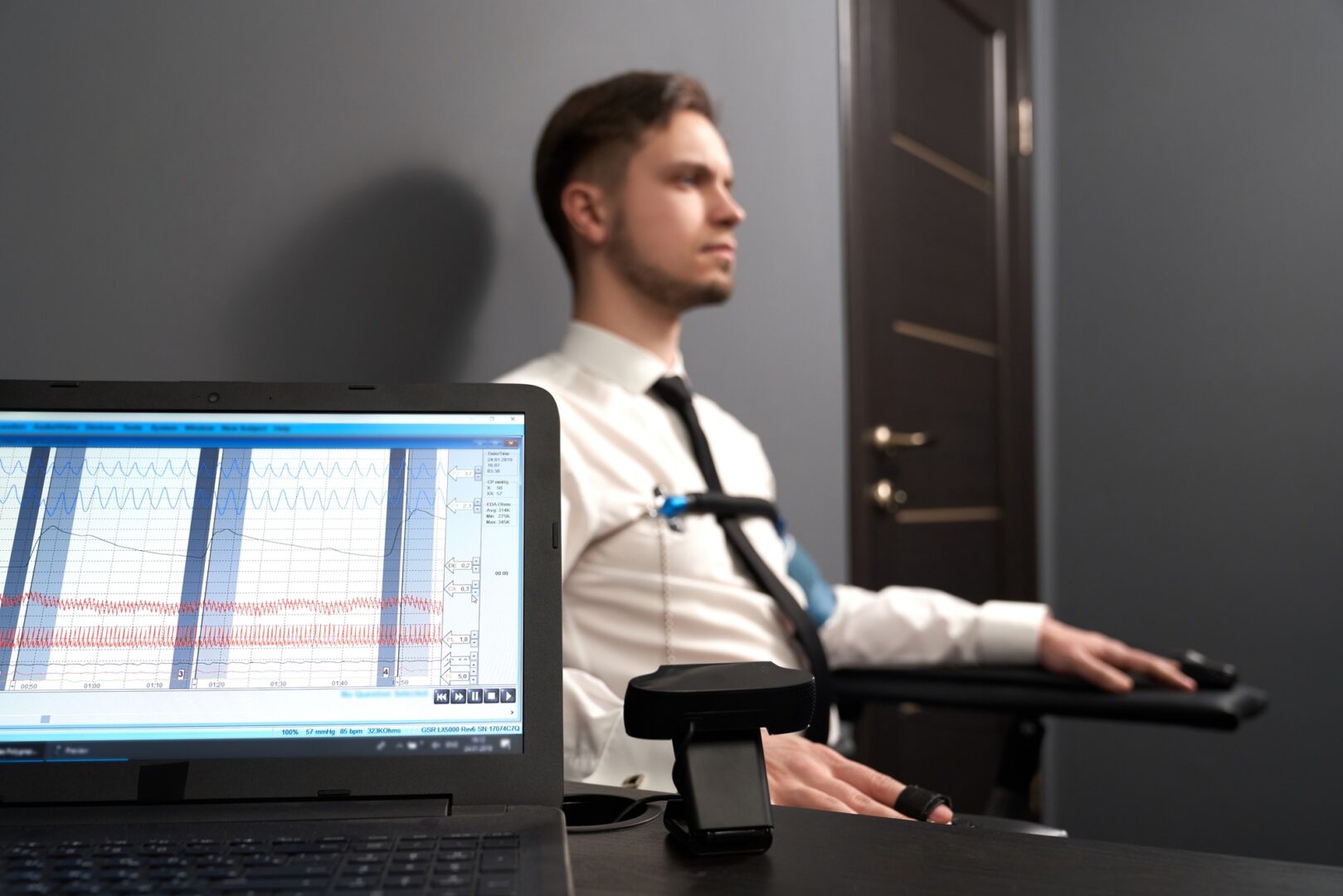 A forensic expert analyzing a handwritten document under a magnifying glass.